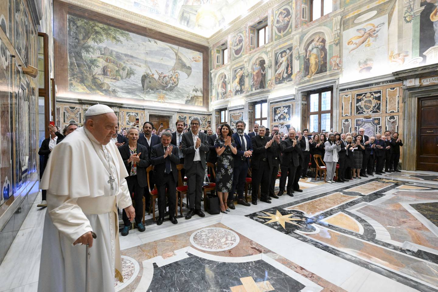 This photo taken and handout on June 14, 2024 by The Vatican Media shows Pope Francis during an audience with comedians in The Vatican. (Photo by Simone Risoluti / VATICAN MEDIA / AFP) / RESTRICTED TO EDITORIAL USE - MANDATORY CREDIT "AFP PHOTO / VATICAN MEDIA" - NO MARKETING - NO ADVERTISING CAMPAIGNS - DISTRIBUTED AS A SERVICE TO CLIENTS