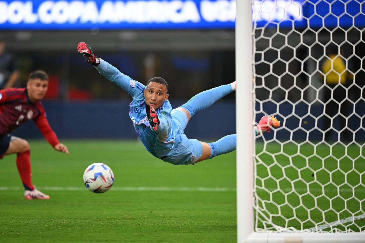 Costa Rica's goalkeeper #23 Patrick Sequeira fails to save the ball during the Conmebol 2024 Copa America tournament group D football match between Brazil and Costa Rica at SoFi Stadium in Inglewood, California on June 24, 2024. (Photo by Patrick T. Fallon / AFP)